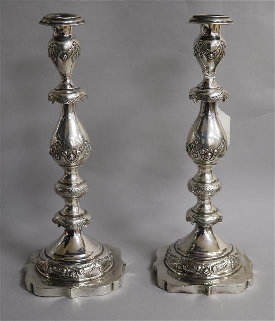 A pair of George V engraved silver Sabbath Day candlesticks, Morris Salkind?, London, 1921, 36.5cm.